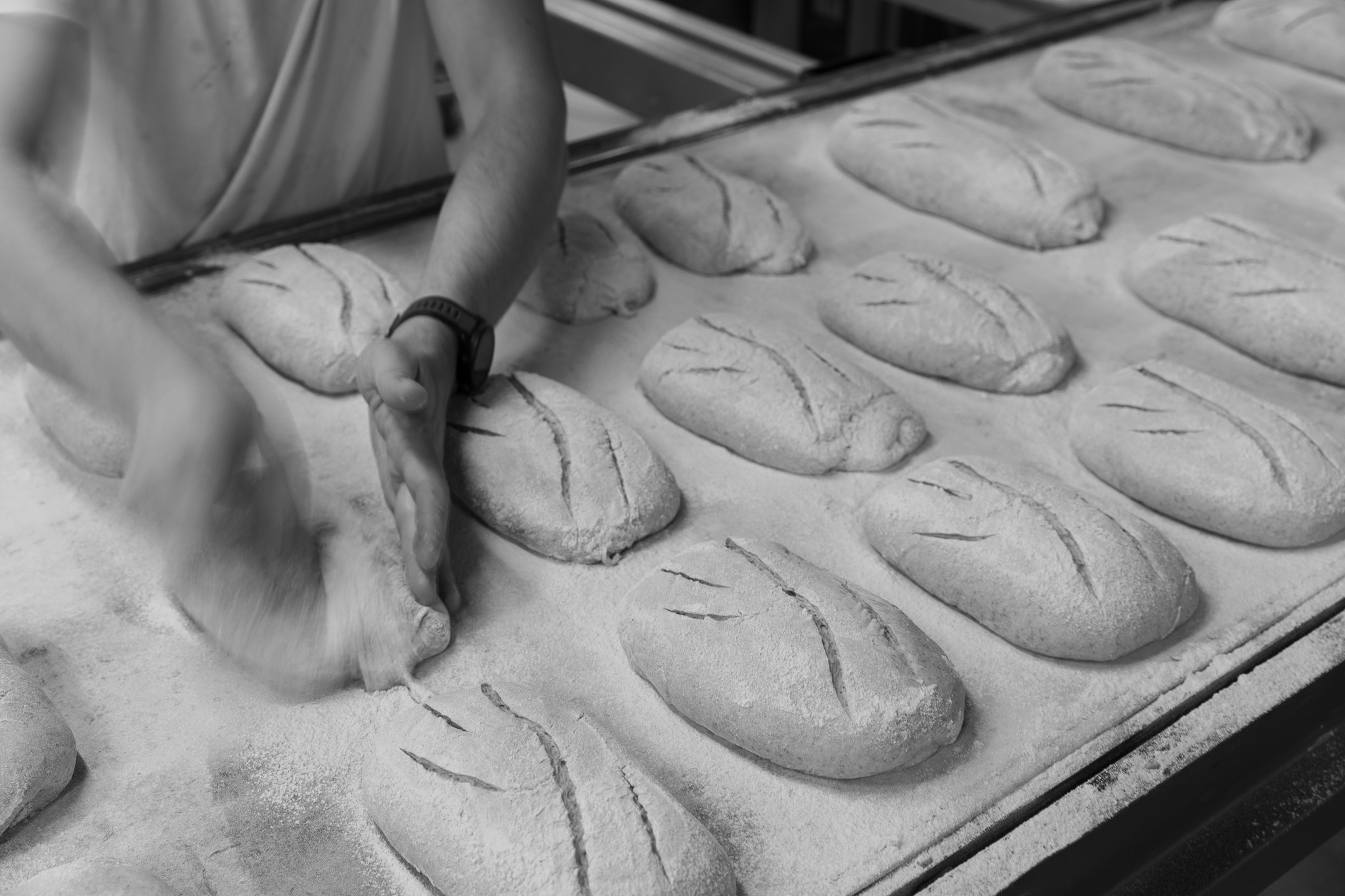 Baker shaping loaves
